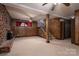The basement is characterized by wood paneling, a fireplace, and a staircase, providing ample space at 2474 Cedar Valley Dr, Conover, NC 28613