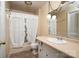 Bright bathroom featuring a vanity with a sink and a window with patterned curtains at 2474 Cedar Valley Dr, Conover, NC 28613