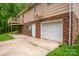 Exterior view of house showing brick details, garage and a deck at 2474 Cedar Valley Dr, Conover, NC 28613