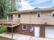 Back of house with deck, garage and a basketball hoop at 2474 Cedar Valley Dr, Conover, NC 28613