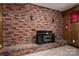 Cozy brick fireplace and hearth create a warm ambiance in this inviting living space at 2474 Cedar Valley Dr, Conover, NC 28613