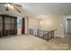 The living room features carpeted floors, neutral walls, and a ceiling fan at 2474 Cedar Valley Dr, Conover, NC 28613