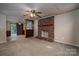 Living room with a fireplace and an open layout, featuring a room divider with shelving at 2474 Cedar Valley Dr, Conover, NC 28613