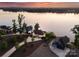 Aerial view showcases a waterfront property surrounded by lush greenery and tranquil lake waters at 249 Landing Trl, Mount Gilead, NC 27306