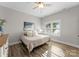 Inviting bedroom featuring a ceiling fan and ample natural light at 249 Landing Trl, Mount Gilead, NC 27306