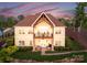 Stunning two-story home featuring a beautiful balcony and inviting outdoor seating area at 249 Landing Trl, Mount Gilead, NC 27306