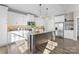 Modern kitchen with shaker cabinets, stainless steel appliances, and granite countertops at 249 Landing Trl, Mount Gilead, NC 27306