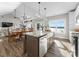 Open-concept kitchen with stainless steel appliances, an island, and beautiful dining area at 249 Landing Trl, Mount Gilead, NC 27306
