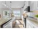 Bright kitchen featuring an island, shaker cabinets, stainless steel appliances and a water view at 249 Landing Trl, Mount Gilead, NC 27306