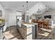 Modern kitchen with island, farmhouse sink, pendant lights and stainless-steel appliances at 249 Landing Trl, Mount Gilead, NC 27306