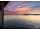 Scenic lake view capturing the sunset over calm waters, offering a serene atmosphere at 249 Landing Trl, Mount Gilead, NC 27306