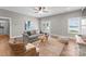 Spacious living room with large windows and comfortable furniture at 249 Landing Trl, Mount Gilead, NC 27306
