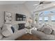 Bright living room featuring high ceilings, large windows, and elegant decor, offering stunning water views at 249 Landing Trl, Mount Gilead, NC 27306
