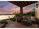 Inviting outdoor patio with comfortable seating and picturesque lake views, perfect for relaxing and entertaining at 249 Landing Trl, Mount Gilead, NC 27306