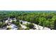 Aerial view of a neighborhood with tree-lined streets and well-maintained homes at 3032 Mallard Forest Dr, Charlotte, NC 28269