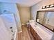Bathroom with modern fixtures including a sink, toilet, tub and vanity at 3032 Mallard Forest Dr, Charlotte, NC 28269