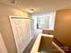 Hallway features neutral walls, carpet, and access to other rooms at 3032 Mallard Forest Dr, Charlotte, NC 28269