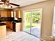 Bright kitchen with stainless steel appliances, tile backsplash and sliding glass doors at 3032 Mallard Forest Dr, Charlotte, NC 28269