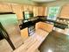 Updated kitchen featuring stainless steel appliances, wooden cabinets, and granite countertops at 3032 Mallard Forest Dr, Charlotte, NC 28269