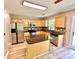 Well-lit kitchen featuring stainless steel appliances, wooden cabinets, and granite countertops at 3032 Mallard Forest Dr, Charlotte, NC 28269