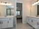 Dual sink bathroom with a view of the bedroom, featuring a modern design at 306 Cloudcroft Aly, Charlotte, NC 28217