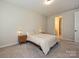 Another angle of the bedroom with natural light with side tables and lamps at 306 Cloudcroft Aly, Charlotte, NC 28217