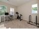 Bright bedroom with carpet flooring, features a comfortable desk area, and a workout area at 306 Cloudcroft Aly, Charlotte, NC 28217