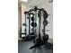Well-equipped home gym featuring a smith machine and a variety of weight plates for a comprehensive workout at 306 Cloudcroft Aly, Charlotte, NC 28217