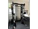 This home gym has a smith machine with a variety of weight plates, dumbbells and a window for natural light at 306 Cloudcroft Aly, Charlotte, NC 28217