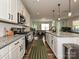 Modern kitchen featuring stainless steel appliances, a spacious island with seating, and stylish white cabinetry at 306 Cloudcroft Aly, Charlotte, NC 28217