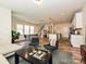 Stylish open-concept living space featuring a modern kitchen with a large island and comfortable seating area at 306 Cloudcroft Aly, Charlotte, NC 28217
