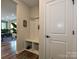 Another angle of functional mudroom with built-in storage, bench seating, and convenient coat hooks at 306 Cloudcroft Aly, Charlotte, NC 28217