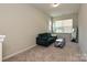Cozy sitting room featuring a comfortable couch, coffee table, and natural light at 306 Cloudcroft Aly, Charlotte, NC 28217
