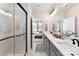 Elegant bathroom showcases a glass shower, dual sinks, and seamless transition to the bedroom at 316 S Turner Ave # 11, Charlotte, NC 28208