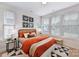 Bright bedroom with three large windows, stylish decor, and comfortable furnishings at 316 S Turner Ave # 11, Charlotte, NC 28208