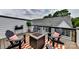 Relaxing deck with a fire pit and comfortable seating arrangements, creating a cozy outdoor space at 316 S Turner Ave # 11, Charlotte, NC 28208