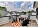 Outdoor deck featuring a fire pit and Adirondack chairs, perfect for entertaining and relaxing at 316 S Turner Ave # 11, Charlotte, NC 28208