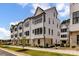 Beautiful townhome showcasing a modern exterior with white siding and brick accents at 316 S Turner Ave # 11, Charlotte, NC 28208