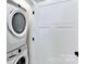 Compact laundry area features a stacked washer and dryer unit for space-saving efficiency at 316 S Turner Ave # 11, Charlotte, NC 28208