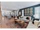 This living room is spacious, has modern decor, and opens to the kitchen at 316 S Turner Ave # 11, Charlotte, NC 28208