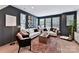 Comfortable living room with large windows, a cozy sofa, and stylish decor at 316 S Turner Ave # 11, Charlotte, NC 28208