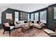 Stylish living room boasts a trendy rug, comfortable sofas, and abundant natural light at 316 S Turner Ave # 11, Charlotte, NC 28208