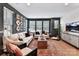 Comfortable and bright living room featuring a large sofa, stylish decor, and ample natural light at 316 S Turner Ave # 11, Charlotte, NC 28208