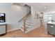 Bright foyer features a modern staircase with wood treads and white risers at 316 S Turner Ave # 11, Charlotte, NC 28208