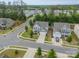 An aerial view showcases the neighborhood, mature trees and a beautifully landscaped yard at 3205 Berry Creek Rd, Charlotte, NC 28214