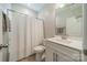 Clean bathroom with a white vanity, toilet, and shower/tub combination at 3205 Berry Creek Rd, Charlotte, NC 28214