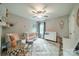 Bright Bedroom features a crib, changing table, soft rug, and cozy seating area at 3205 Berry Creek Rd, Charlotte, NC 28214