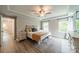 Primary bedroom boasts natural light, tray ceiling, and neutral decor at 3205 Berry Creek Rd, Charlotte, NC 28214