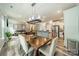 Dining area with stylish lighting fixture that adjoins the living room and kitchen at 3205 Berry Creek Rd, Charlotte, NC 28214
