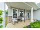 Inviting front porch featuring stone accents, and chairs for relaxing at 3205 Berry Creek Rd, Charlotte, NC 28214